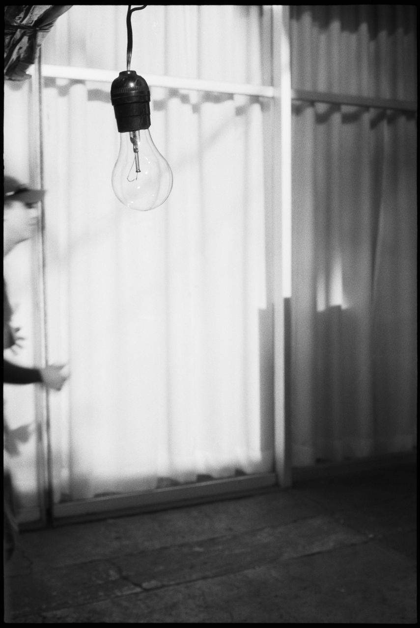 indoors, lighting equipment, hanging, focus on foreground, light bulb, no people, electricity, domestic room, close-up, illuminated, architecture, home interior, built structure, day, glass - material, absence, electric light, chandelier, selective focus, ceiling, electric lamp, light fixture