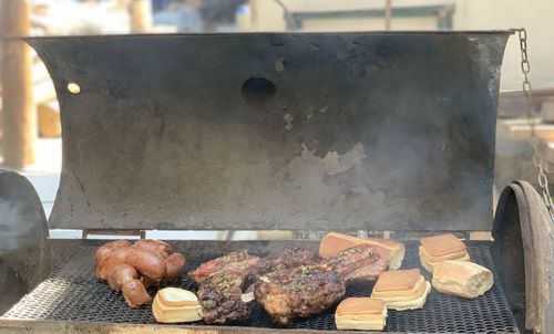 High angle view of meat on barbecue grill