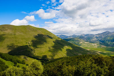 Scenic view of landscape against sky in castelluccio, umbria 