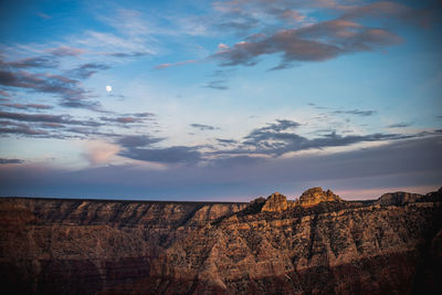 Low angle view of rocks against sky during sunset