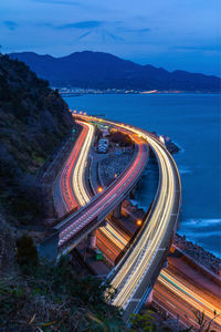 High angle view of light trails on road against sky