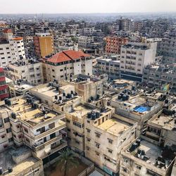 High angle view of buildings in city against sky