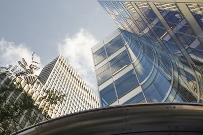 Low angle view of modern buildings against sky