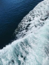 High angle view of water splashing in sea