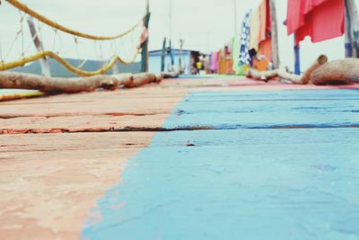 Surface level of street against blue sky