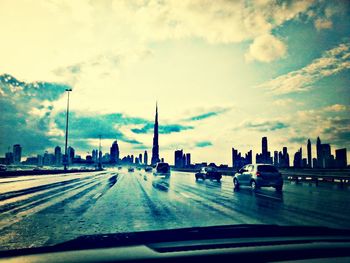 City street against cloudy sky