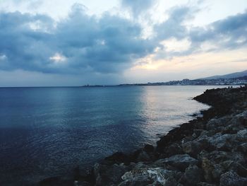 Scenic view of sea against sky at sunset