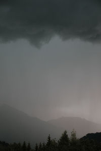 Scenic view of silhouette mountain against sky at dusk