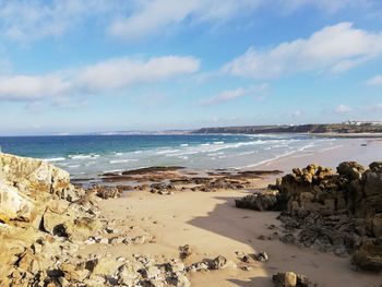 Scenic view of beach against sky