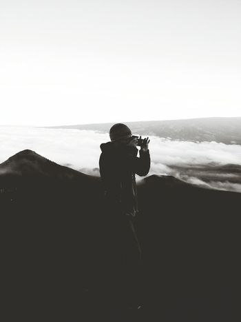 Silhouette of man photographing