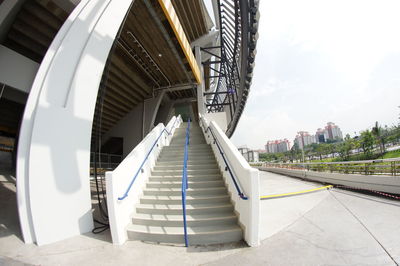 Steps in city against sky