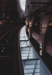 Railroad tracks in city seen through train