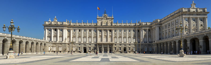 Facade of building in city against clear sky