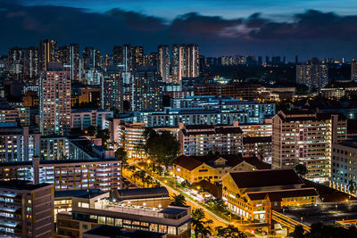 High angle view of illuminated buildings in city at night