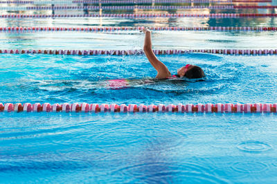 High angle view of girl swimming in pool