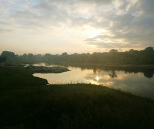 Scenic view of lake against sky during sunset