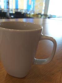 Close-up of coffee cup on table