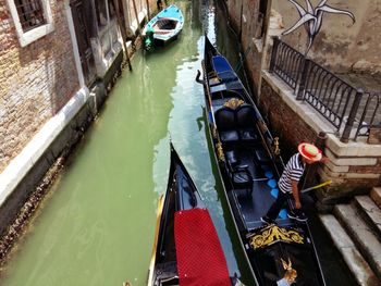 High angle view of man on gondola at canal