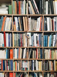 Books arranged on shelves at bookstore