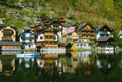 Reflection of buildings and trees in lake