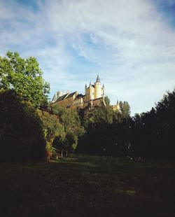 View of trees and buildings against sky