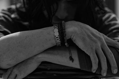 Midsection of woman wearing bracelets