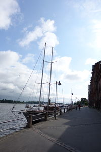 Ship moored on sea against sky