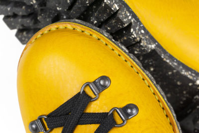 Yellow hiker boots with spotted sole and stormwelted closeup