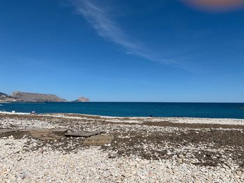 Scenic view of sea against blue sky