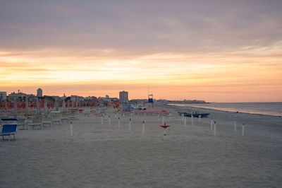 Scenic view of beach against sky during sunset