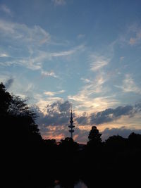 Silhouette of tree against cloudy sky