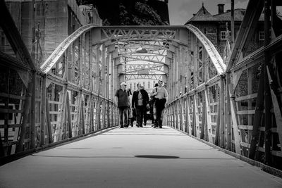 Rear view of people walking in corridor