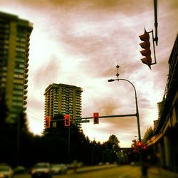 Low angle view of building against cloudy sky