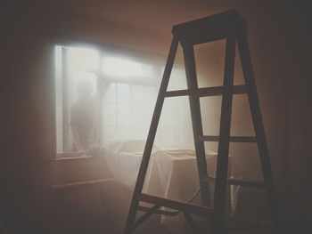 Man seen through window at home