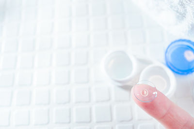 Close-up of hand holding paper