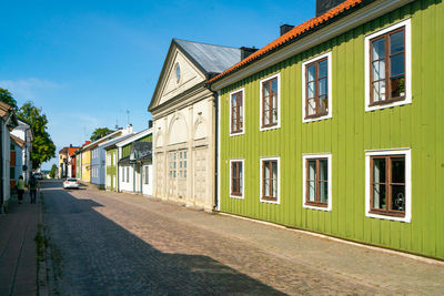 Street amidst buildings against sky