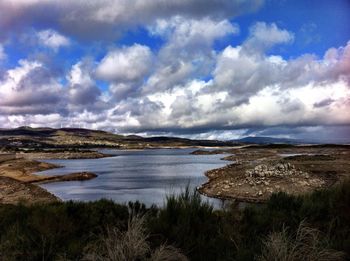 Scenic view of landscape against cloudy sky