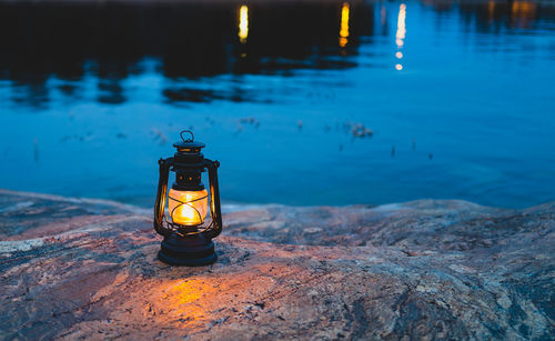 High angle view of lantern by sea 