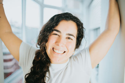 Portrait of smiling young woman looking away