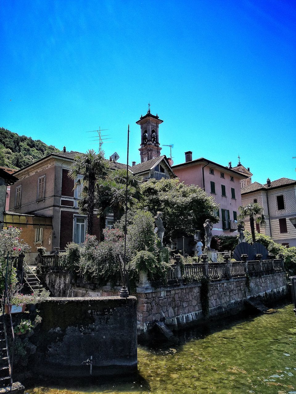 OLD BUILDING AGAINST CLEAR BLUE SKY