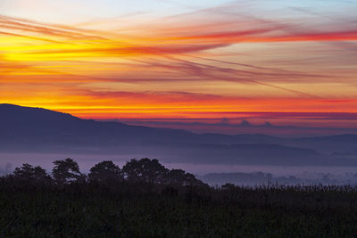 Scenic view of mountains against sky during sunset