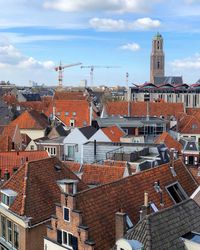 High angle view of buildings in city against sky