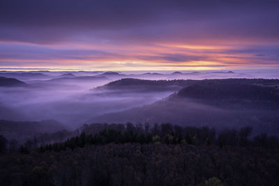 Scenic view of mountains against sky during sunset