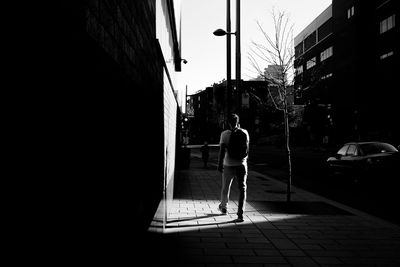 Man walking on street in city