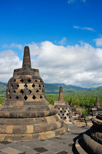 View of temple against cloudy sky