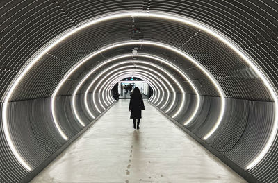 High angle view of people walking in tunnel
