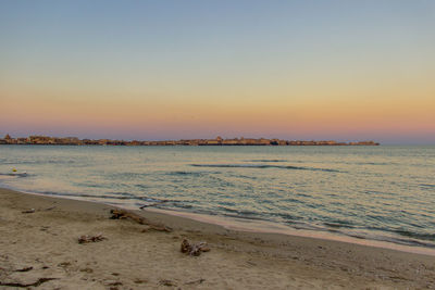 Scenic view of sea against clear sky during sunset