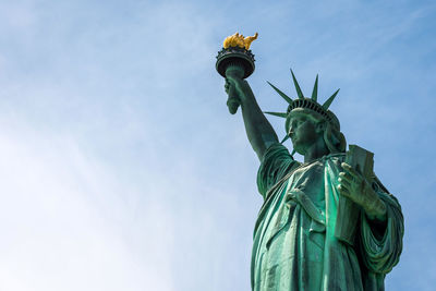 Low angle view of statue against sky