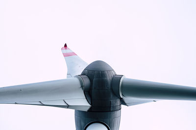 Low angle view of airplane against clear sky