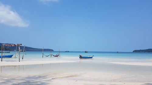 Scenic view of sea against clear blue sky